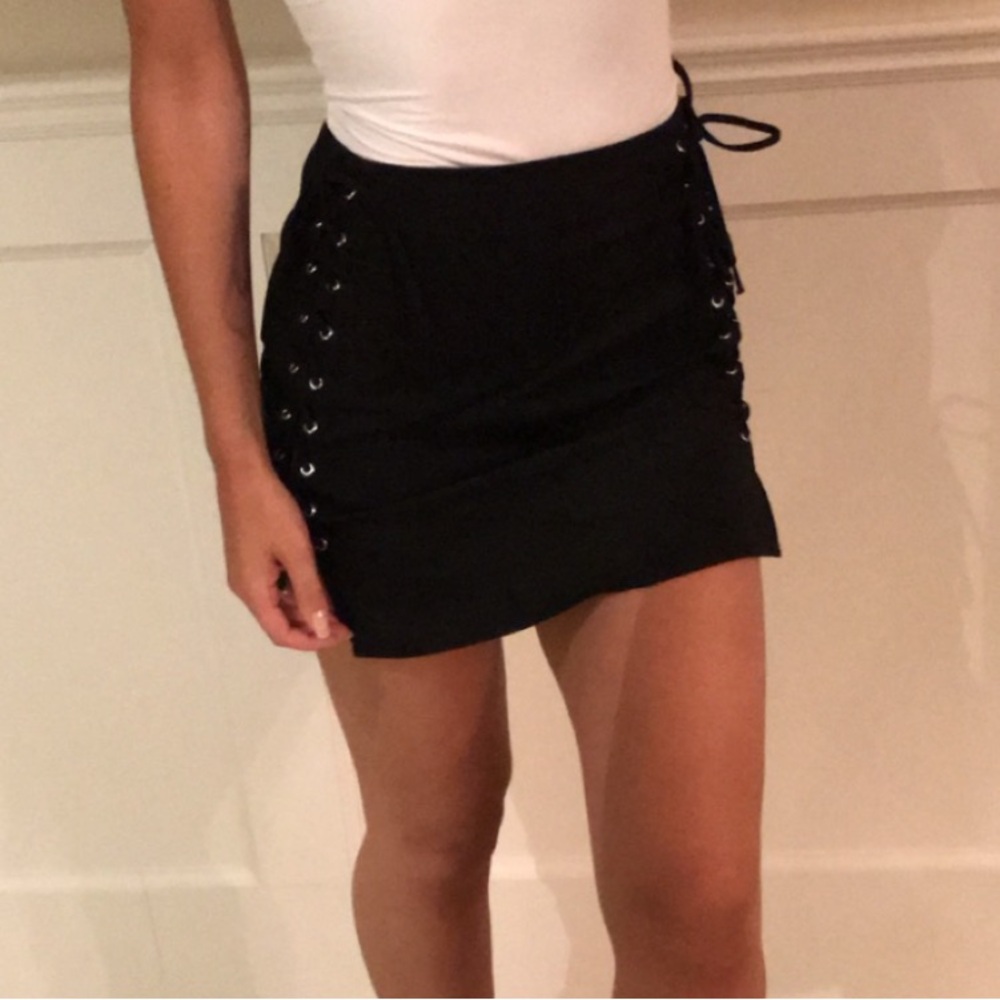 by the way. Black grommet detail skirt